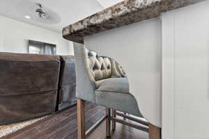 Detailed view of wood finished floors and ceiling fan