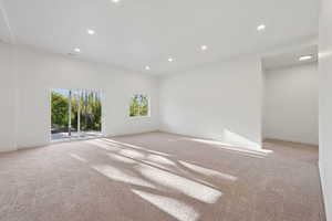 Empty room featuring carpet and recessed lighting