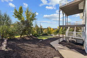 View of yard featuring stairway