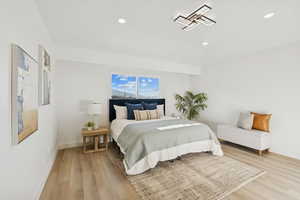 Bedroom featuring light wood-type flooring and recessed lighting