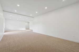 Spare room with recessed lighting and carpet flooring