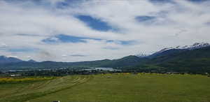View of mountain background featuring rural landscape