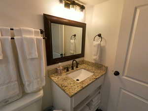 Half bath with vanity and toilet