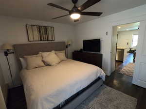 Bedroom featuring dark wood-style flooring and a ceiling fan