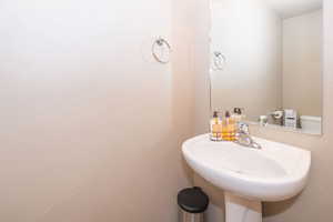 Half bathroom with toilet and a sink