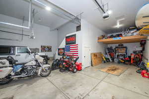 Garage featuring a garage door opener