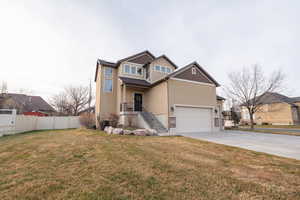 View of front of home featuring concrete driveway, stucco siding, stairs, and a garage