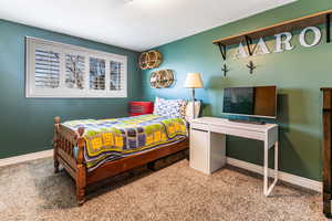 Level 1 1/2 - Bedroom with planation shutters and carpet