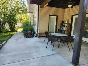 View of patio / terrace featuring outdoor dining area and a ceiling fan