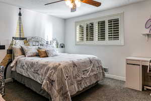 Level 1 1/2 - Bedroom with plantation shutters, carpet, ceiling fan and 2 double closets