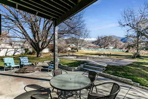 View of patio / terrace featuring a mountain view and outdoor dining space