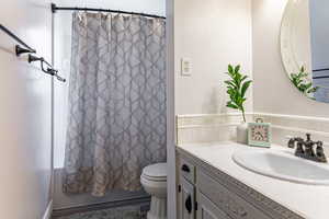 Level 1 1/2 - Full bathroom with vanity and shower / tub combo with curtain