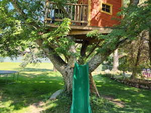 View of play area featuring a wooden deck
