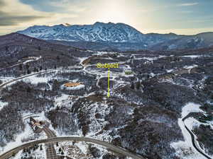 Snowy aerial view with a mountain view