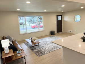 Living room featuring recessed lighting and light wood finished floors
