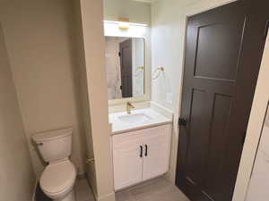 Bathroom with toilet and vanity