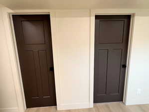 Unfurnished bedroom with light wood-style flooring and baseboards