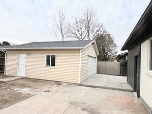 Garage featuring driveway