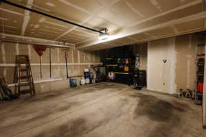 Garage featuring a garage door opener
