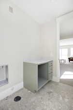 Laundry room featuring baseboards
