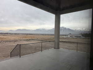 View of patio / terrace with a mountain view and a rural view