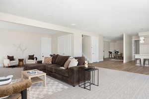 Living area featuring light wood finished floors and stairs