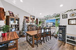 Dining space featuring wood finished floors and recessed lighting
