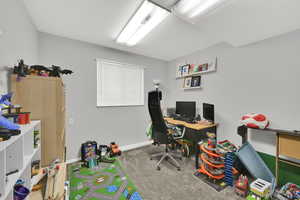 Carpeted office with baseboards