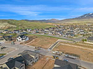 Aerial perspective of suburban area featuring a mountain backdrop