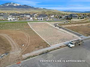 Aerial view of residential area featuring a mountain backdrop