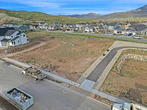 Aerial view of residential area featuring mountains