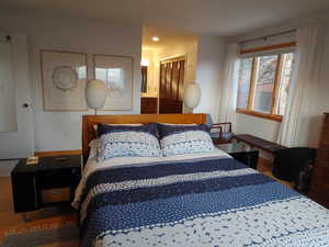 Primary Bedroom with 2 closets, bamboo floors, and ensuite bathroom