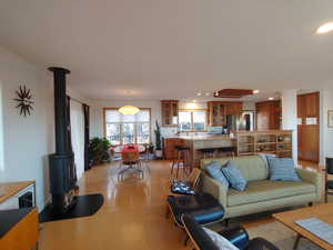 Spacious open room, great for entertaining cork & bamboo flooring, and wood burning stove