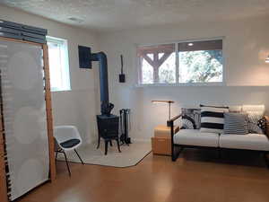 large enough to section off in areas.  Wood burning stove with tile flooring under stove.   Cork flooring