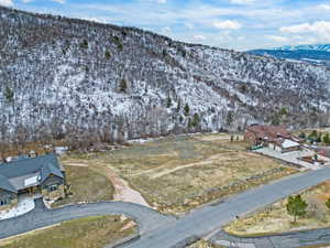 View of subject property with mountains