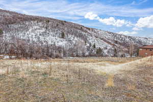 View of mountain background featuring rural landscape