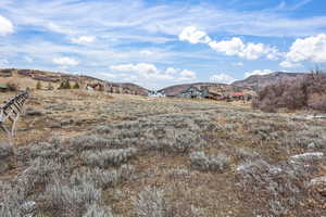 View of mountain background featuring rural landscape