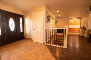 Foyer entrance featuring arched walkways, tile patterned floors, recessed lighting, and ceiling fan
