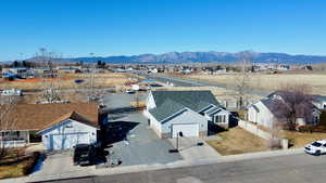 Aerial perspective of suburban area featuring a mountainous background