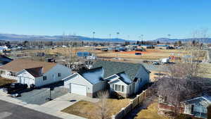 Aerial perspective of suburban area featuring a mountain backdrop