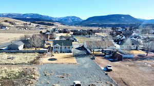 View of mountain backdrop featuring nearby suburban area