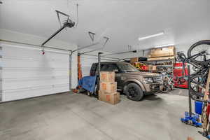 Garage featuring a garage door opener