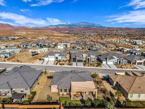 Aerial perspective of suburban area with a mountainous background