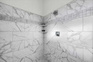 Bathroom featuring tiled shower