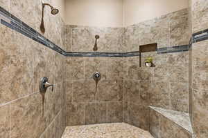 Full bathroom with tiled shower