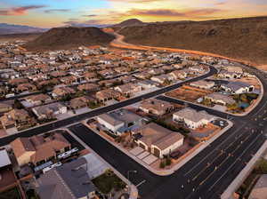 Aerial view at dusk of a residential view and a mountain view