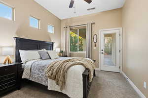 Bedroom with carpet, a ceiling fan, and access to outside