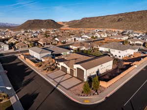 Aerial perspective of suburban area featuring a mountainous background