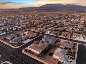 View of property location featuring nearby suburban area and a mountain backdrop