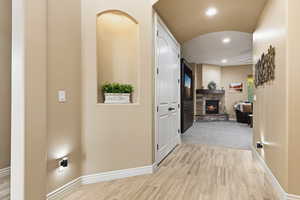 Hall with recessed lighting and wood finish floors